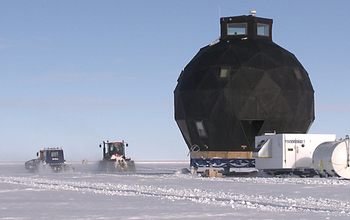 Tractors towing a Danish research station on the ice sheet in Greenland
